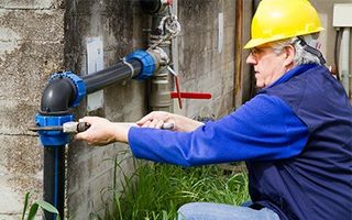 Slab Leak Detection — A plumber fixing a leak in Savannah, GA