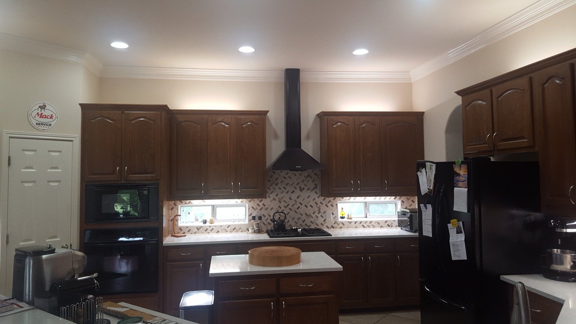 Built-up crown moulding installation in kitchen remodel