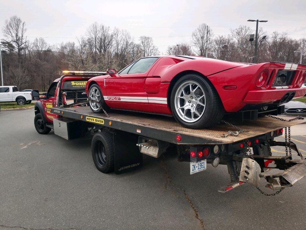 Red Sports Car Being Tow — Winston Salem, NC — Southside Towing of Winston Salem