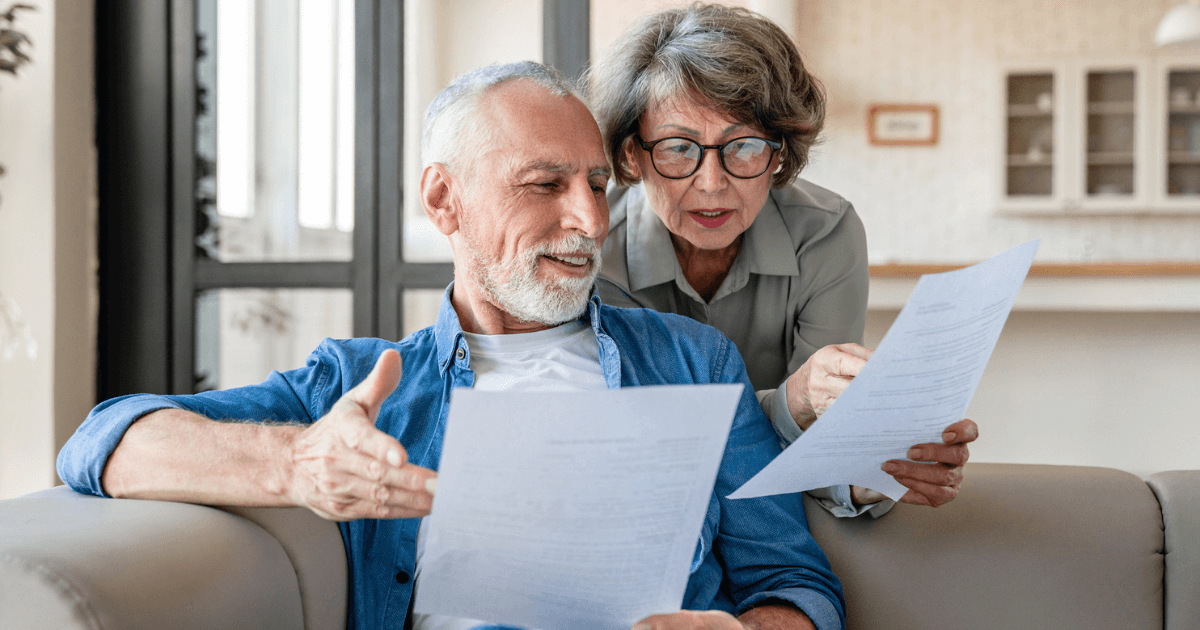 a man and woman comparing cost of assisted living