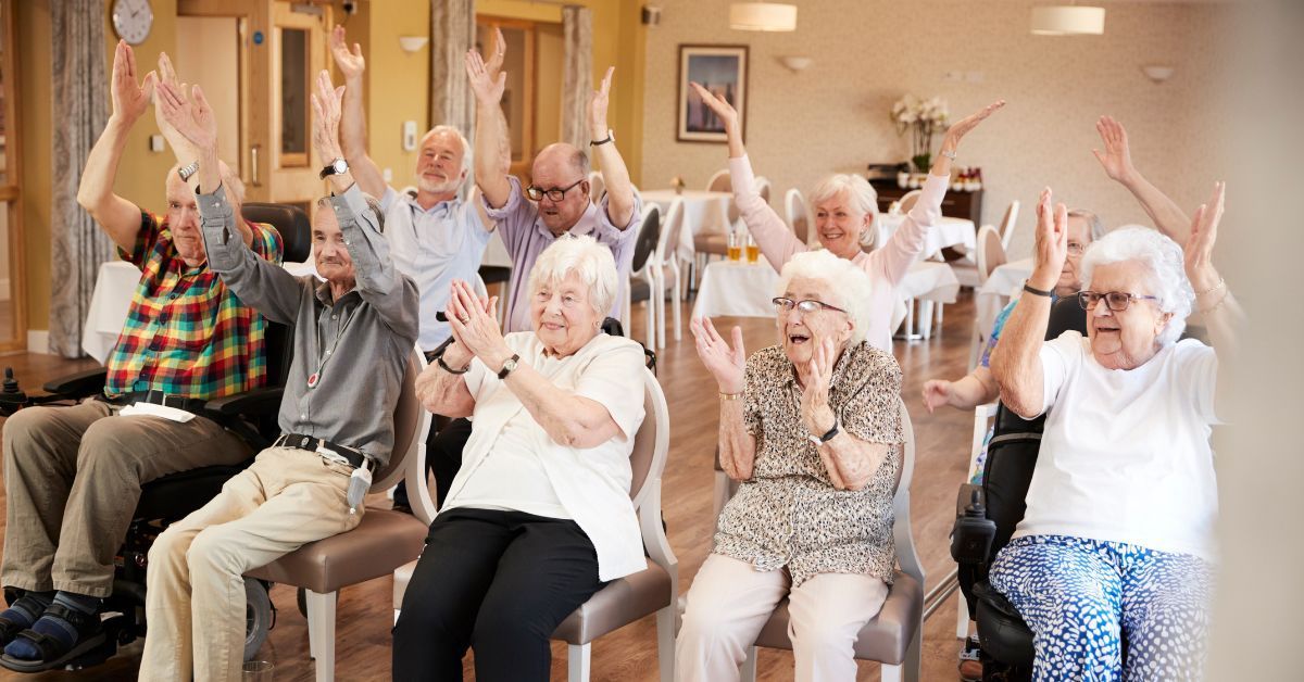 A group of seniors at a assisted living singing