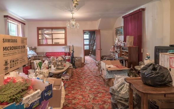 A cluttered house that is for sale