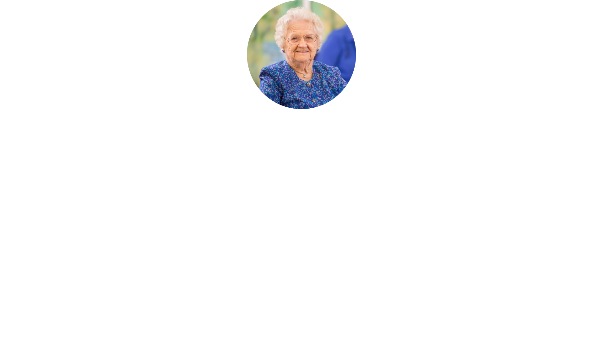an elderly woman in a blue shirt is sitting in a circle on a white background .