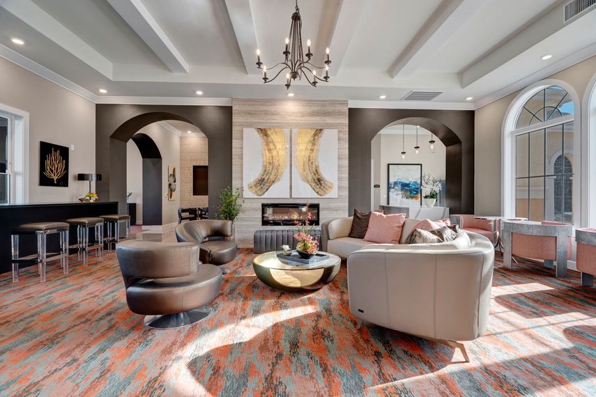 A living room filled with furniture and a fireplace.