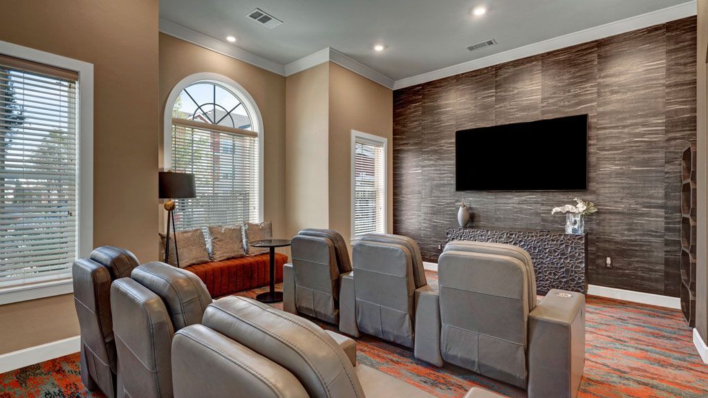A living room filled with furniture and a flat screen tv.