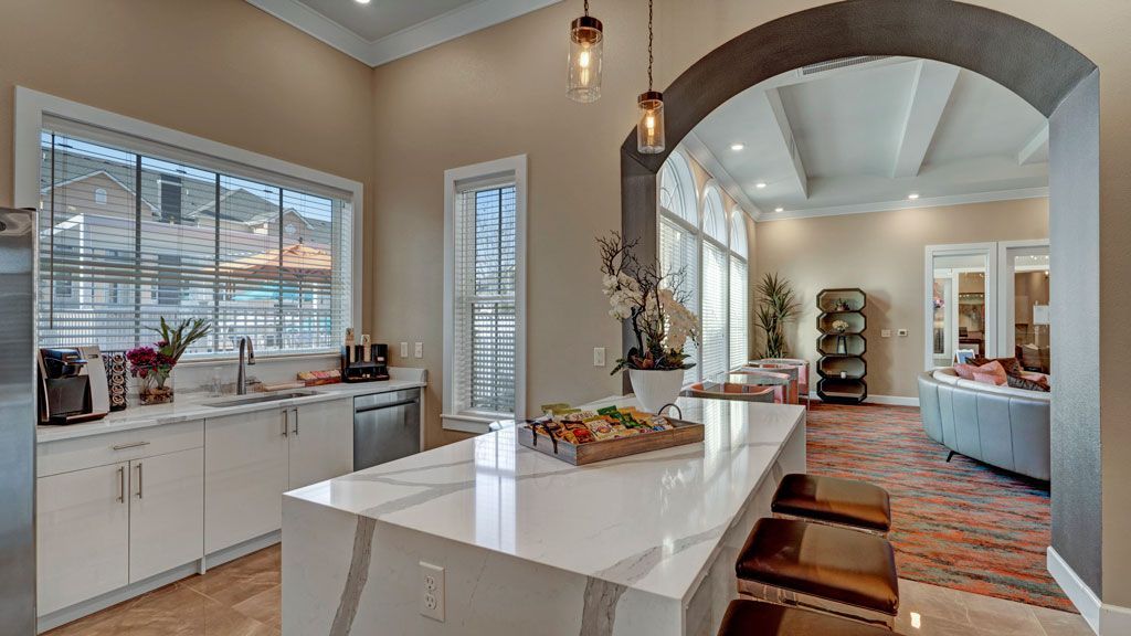 A kitchen with a large island in the middle of the room.