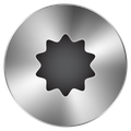 A silver circle with a hole in the middle that looks like a star