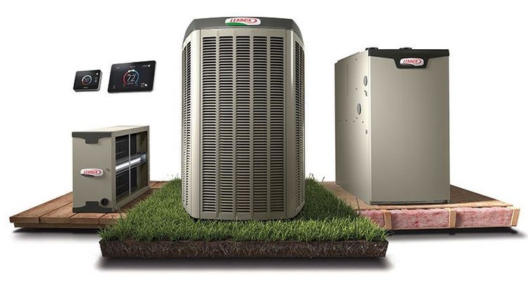 A row of air conditioners are lined up next to each other on a building.
