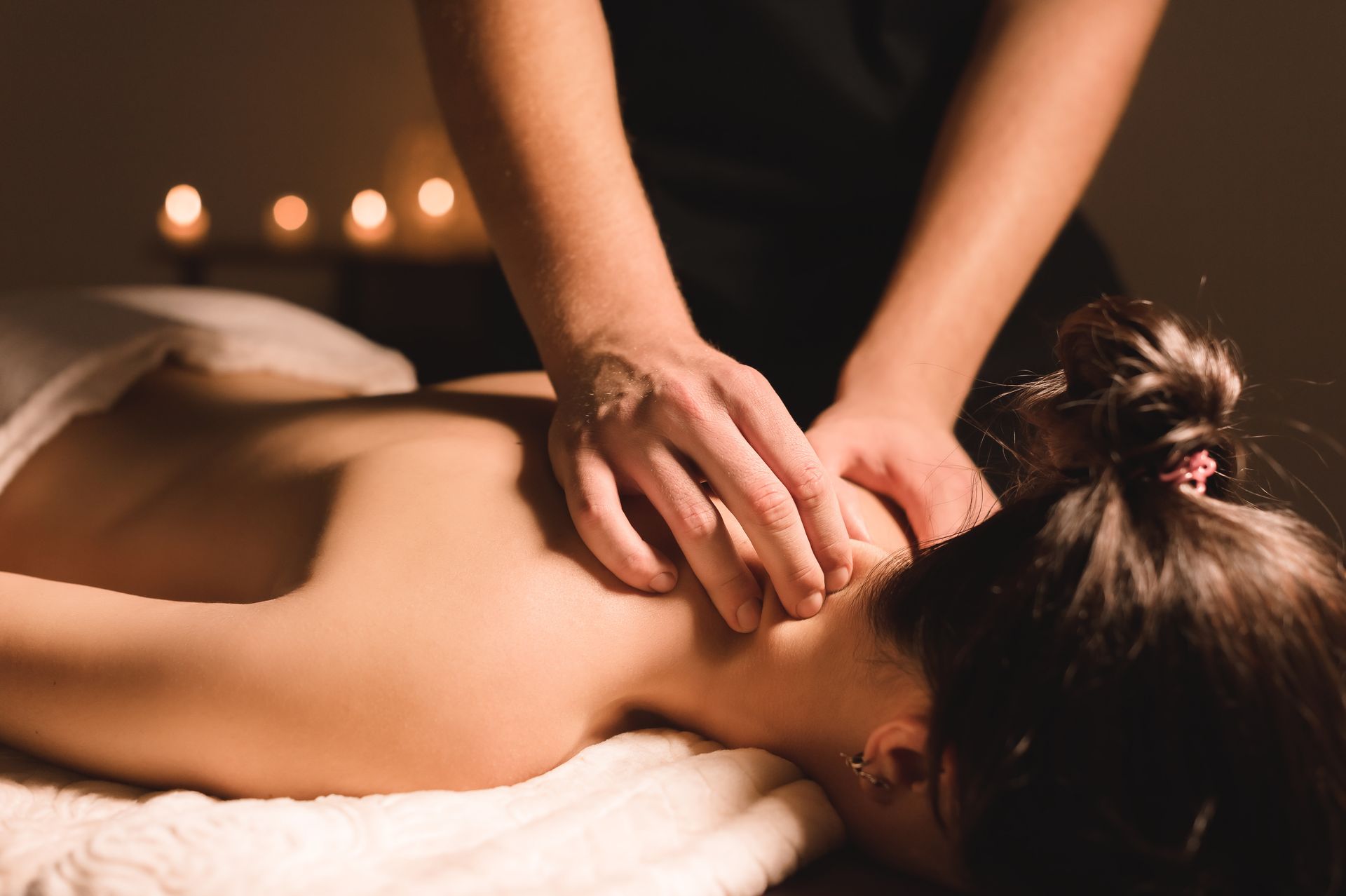 A woman is getting a massage at a spa.