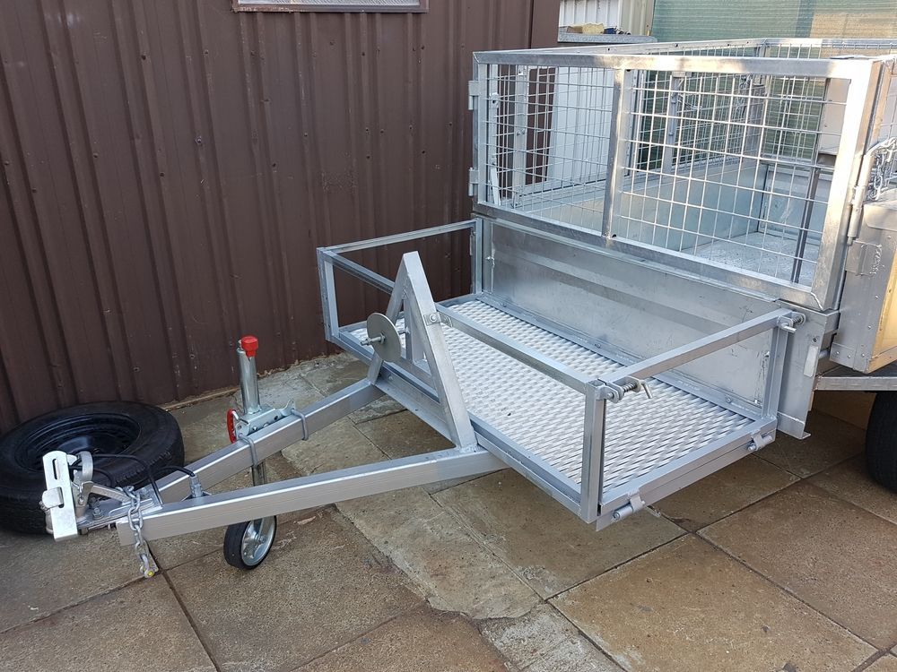 Silver Utility Trailer With Mesh Cage, Spare Tire, and Hitch — GC Custom Fabrication in Molendinar, QLD