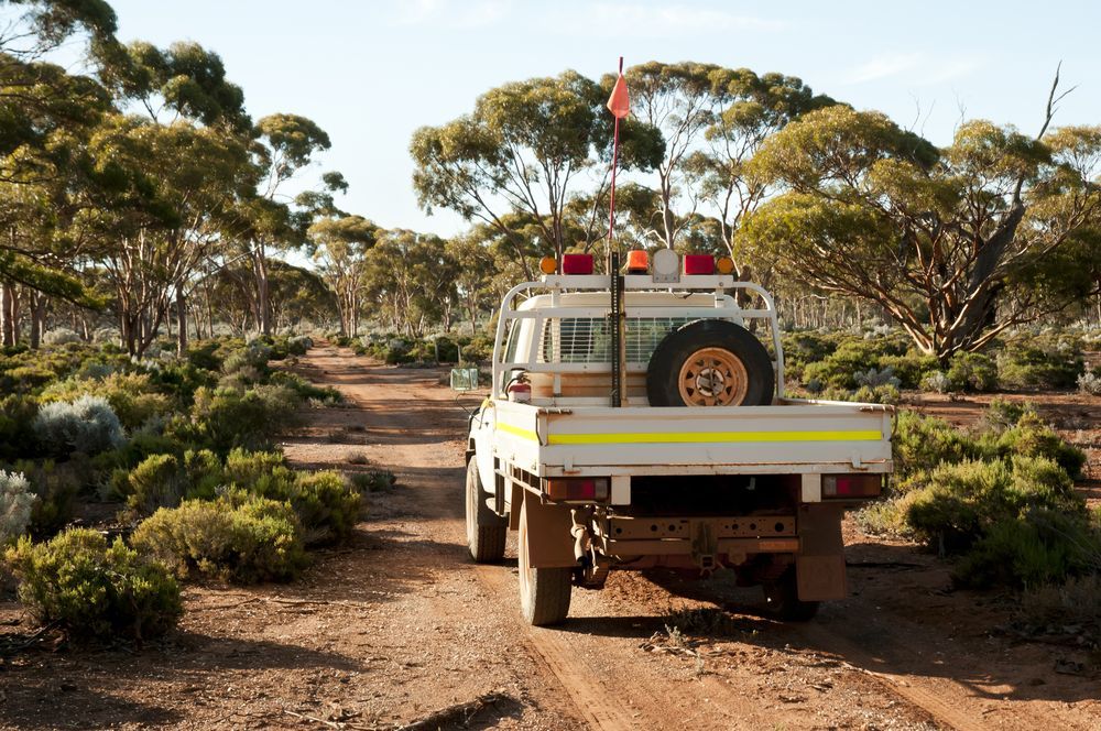 White Utility Vehicle Driving on a Dirt Road — GC Custom Fabrication in Coomera, QLD