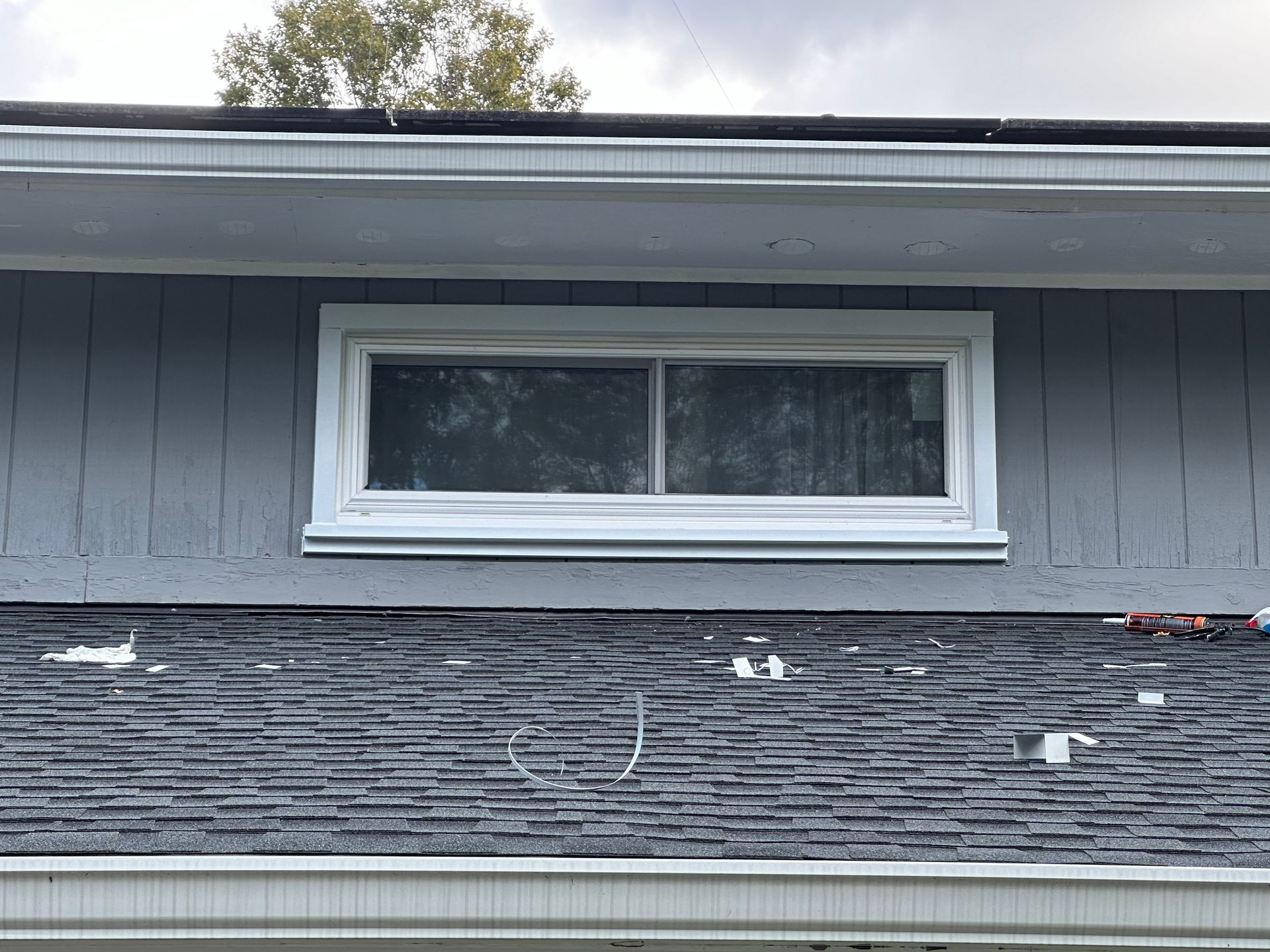 There is a window on the side of a house.