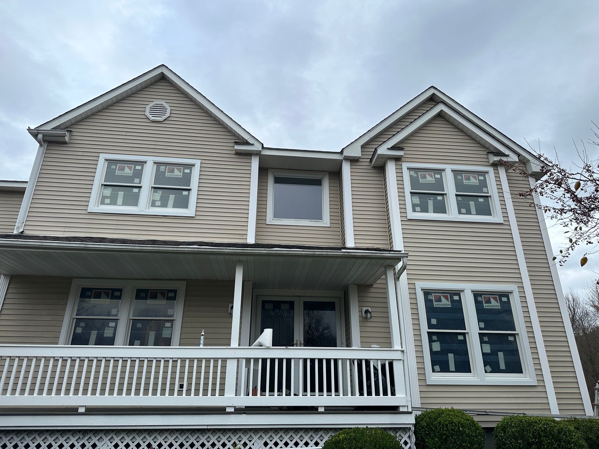 A large house with a balcony and a lot of windows.