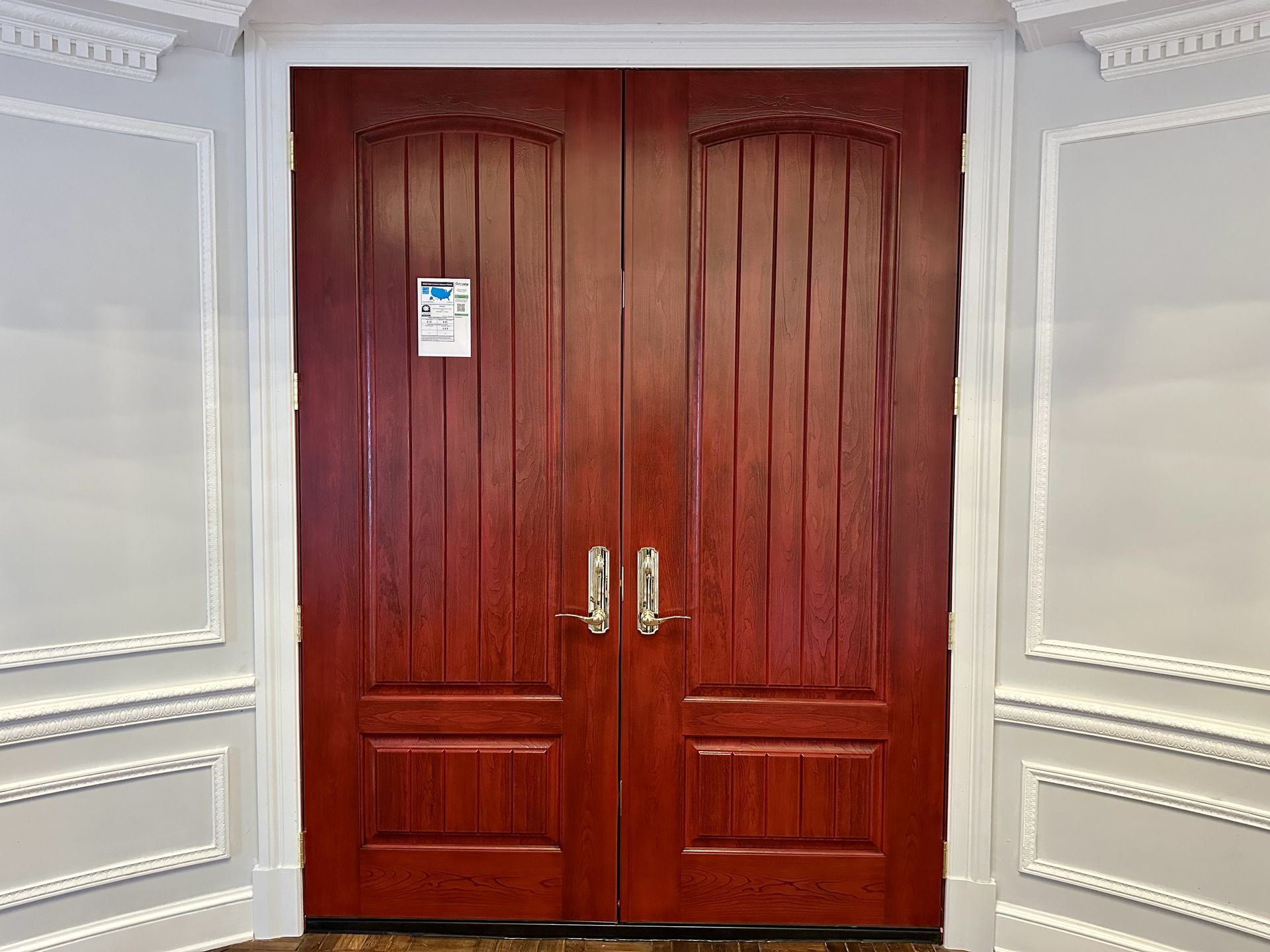 A large house with a balcony and a lot of windows.