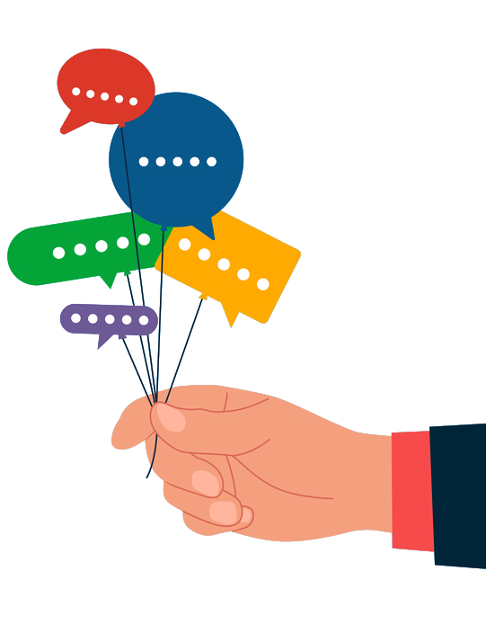 Mano che tiene palloncini a forma di fumetti.