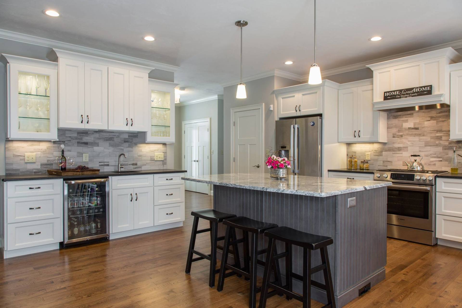 There is a large island in the middle of the kitchen.