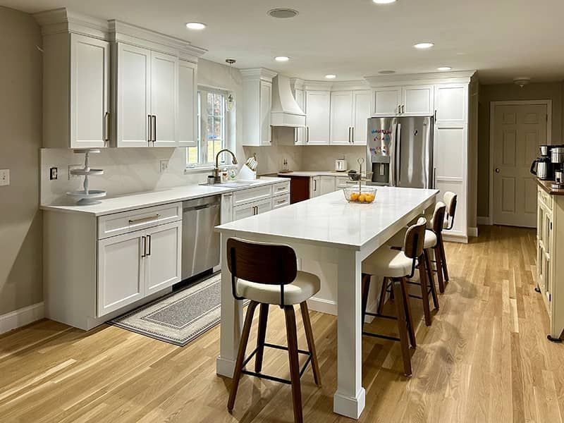 There is a large island in the middle of the kitchen.