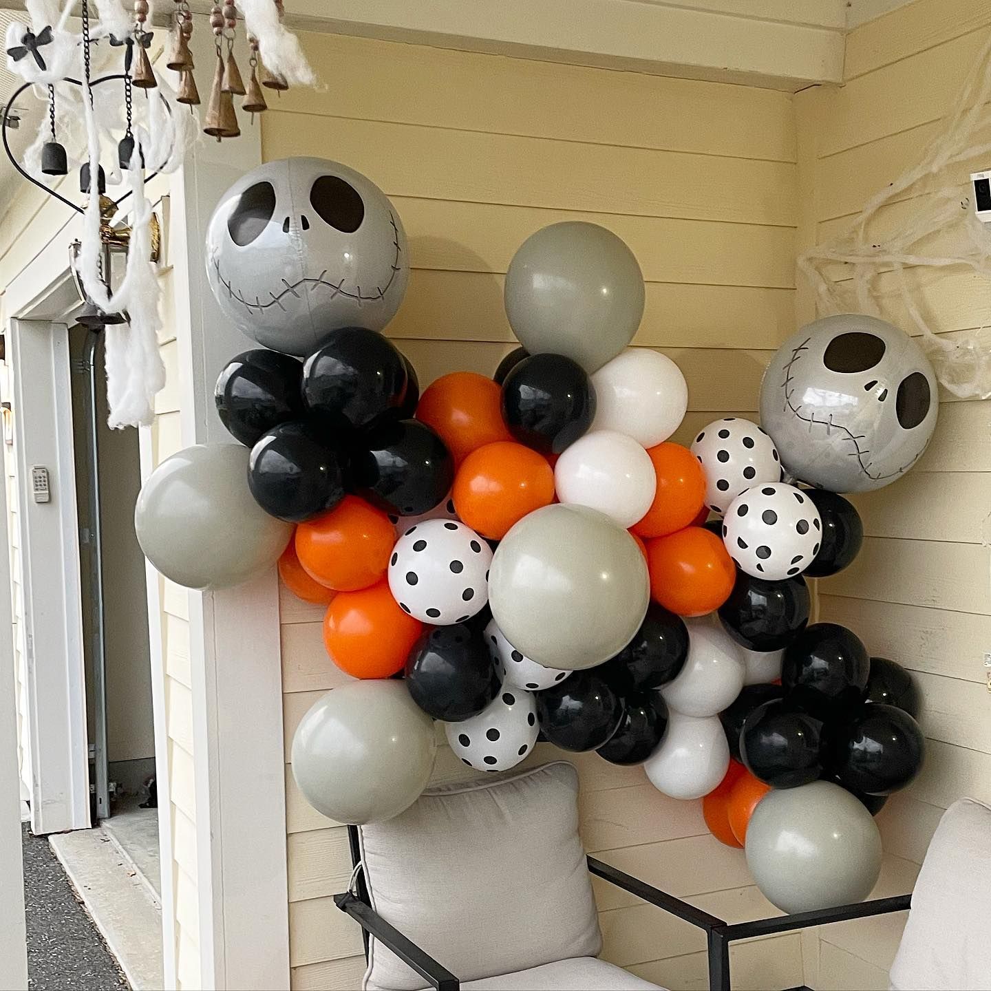 A bunch of balloons with Jack Skellington faces on them.