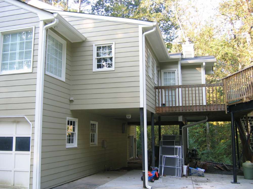 The back of a house with a garage and a deck