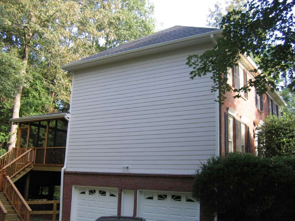 The back of a house with a garage and stairs