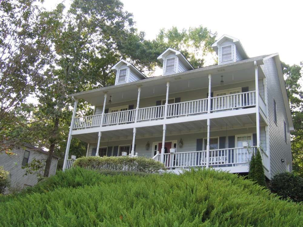 A large white house with a lot of balconies