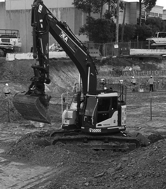 A black and white photo of an excavator that says DEA on it