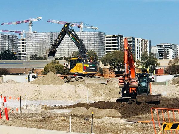 Two excavators working on a construction site