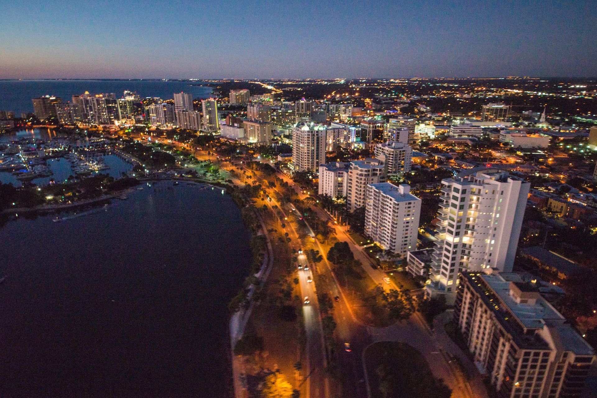 An Aerial View Of A City At Night — St. Petersburg, FL — Executive Helicopter Tours