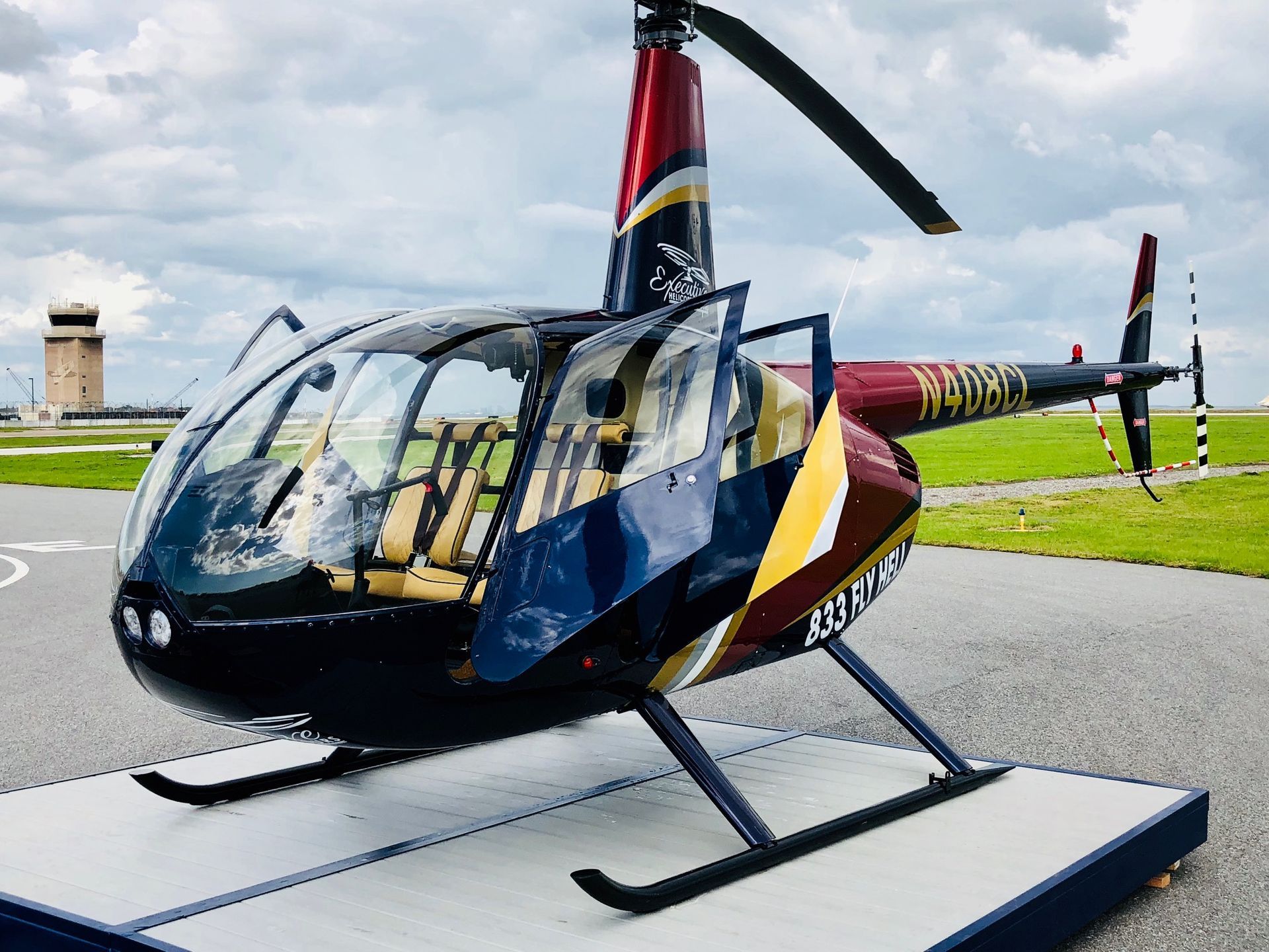 A Small Helicopter Is Parked On A Runway — St. Petersburg, FL — Executive Helicopter Tours