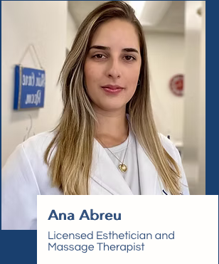 A woman in a white coat is a licensed esthetician and massage therapist.