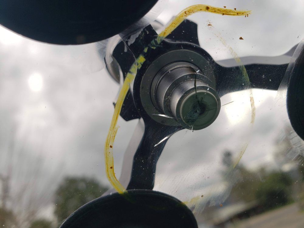 Inside close-up of a windshield repair tool