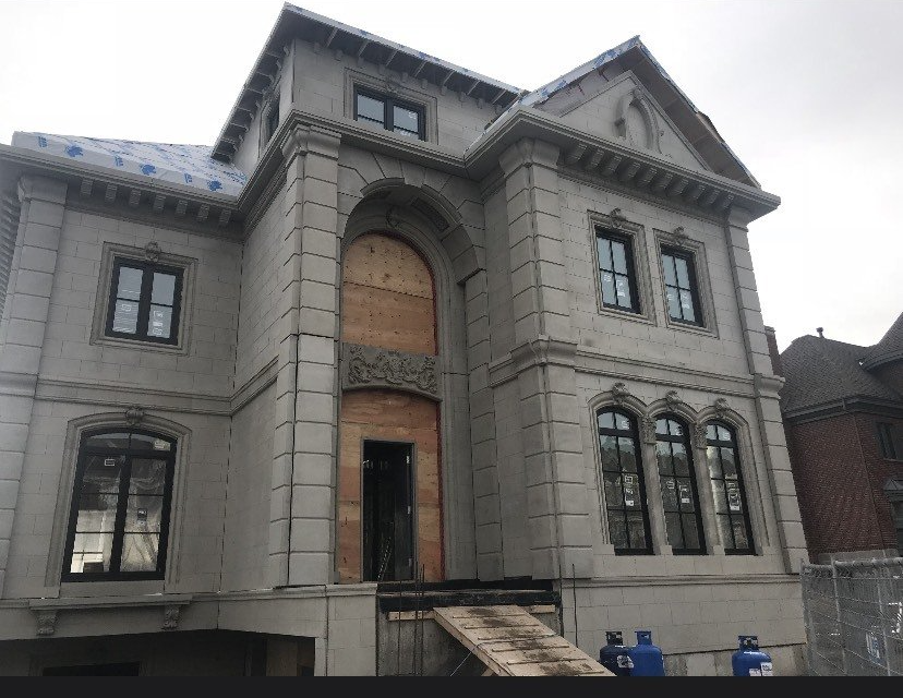 A large building with a lot of windows is being built.