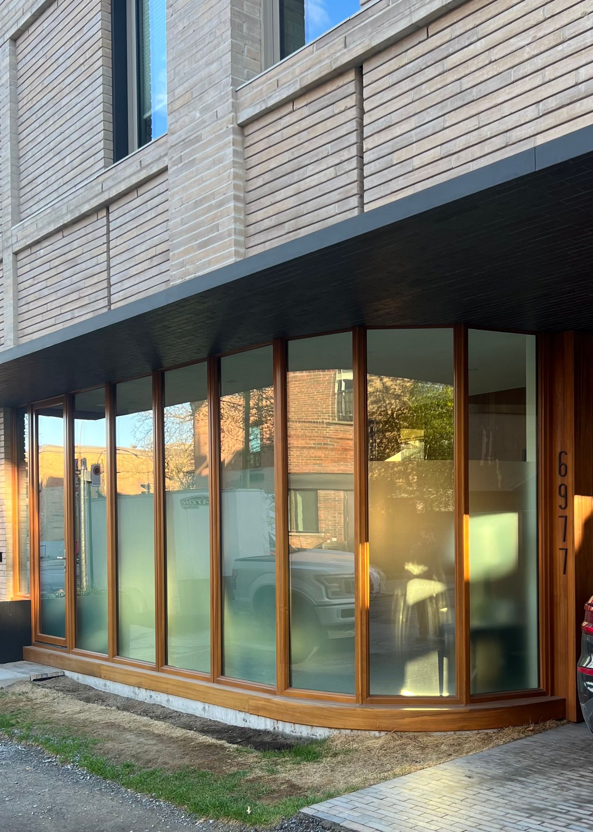 A building with a lot of windows and a wooden door.