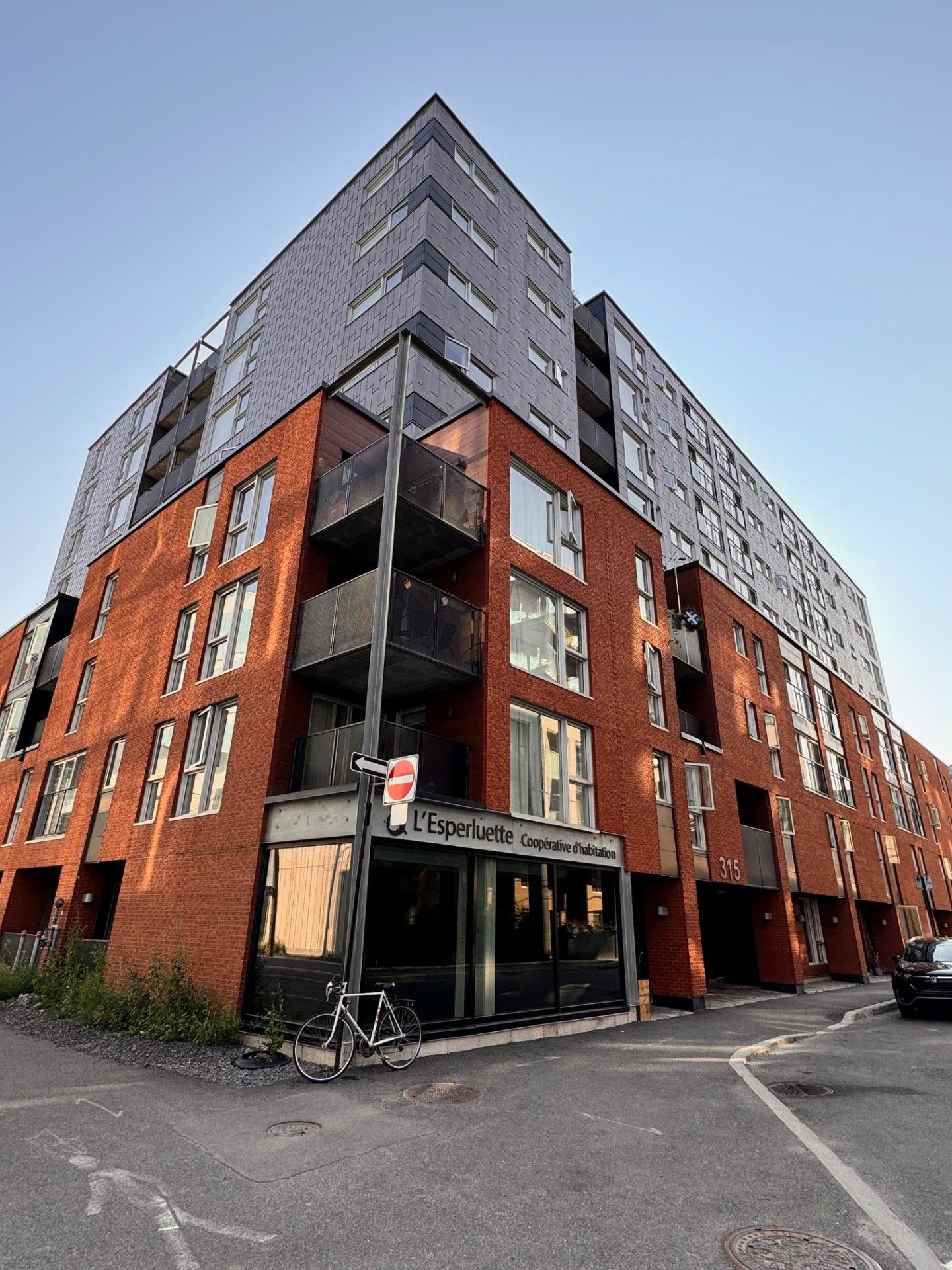 A large brick building with a bicycle parked in front of it