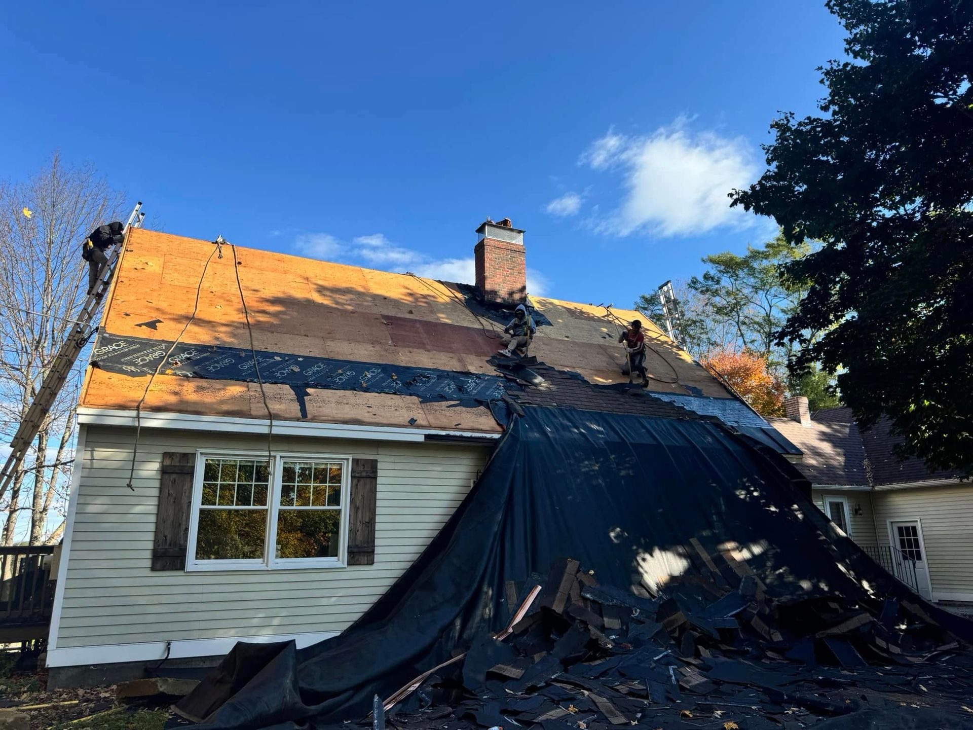 A house is being remodeled and the roof is being removed