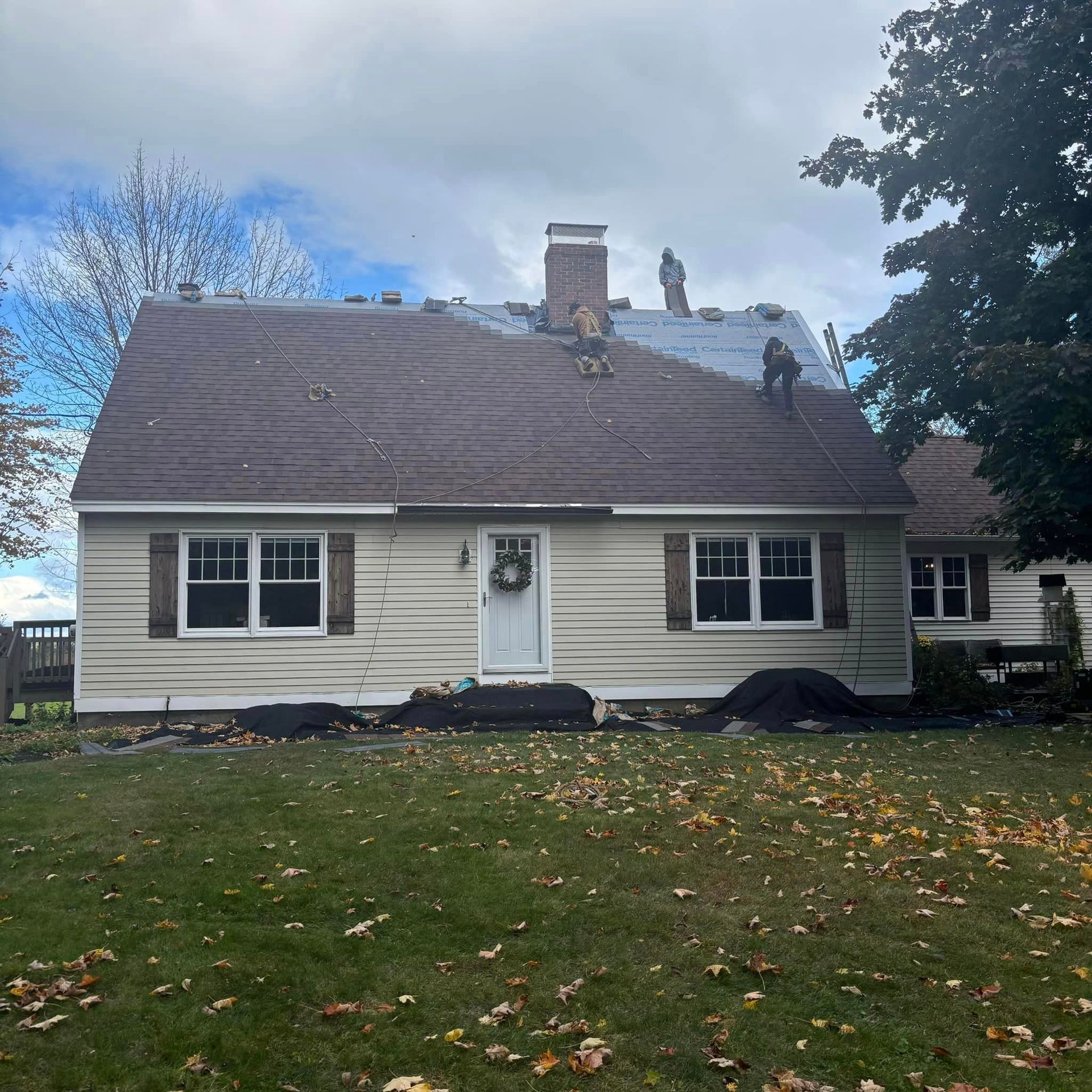 A house with a roof that is being repaired.