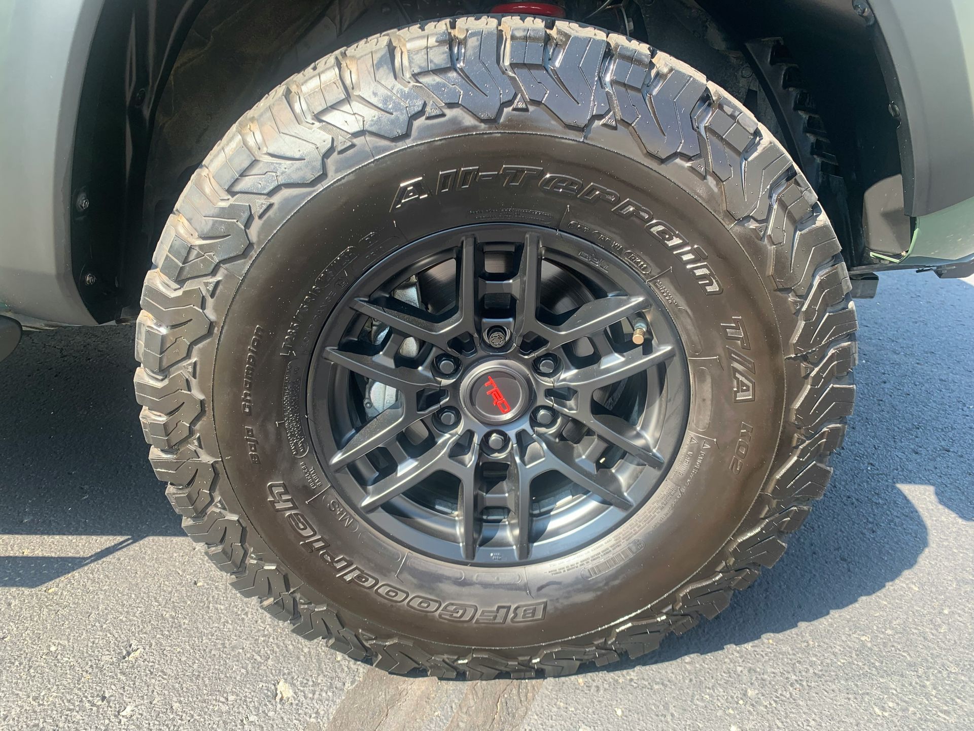 Close-up of a Black Truck Tire and Rim With Off-road Tread — Ben's Tyres in Wellington, NSW