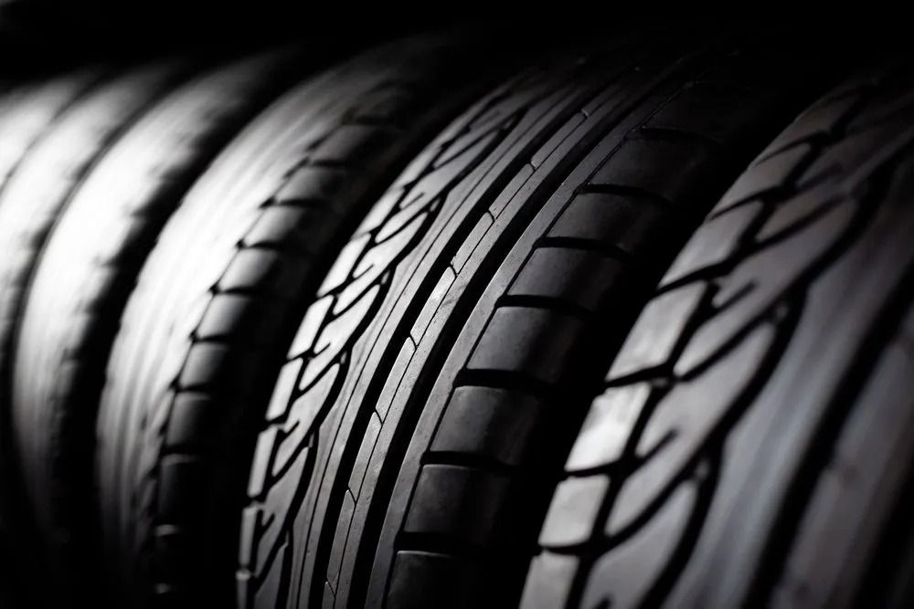 Four Black Car Tires in a Row, Close-up View Showing the Tread Pattern — Ben's Tyres in Wellington, NSW