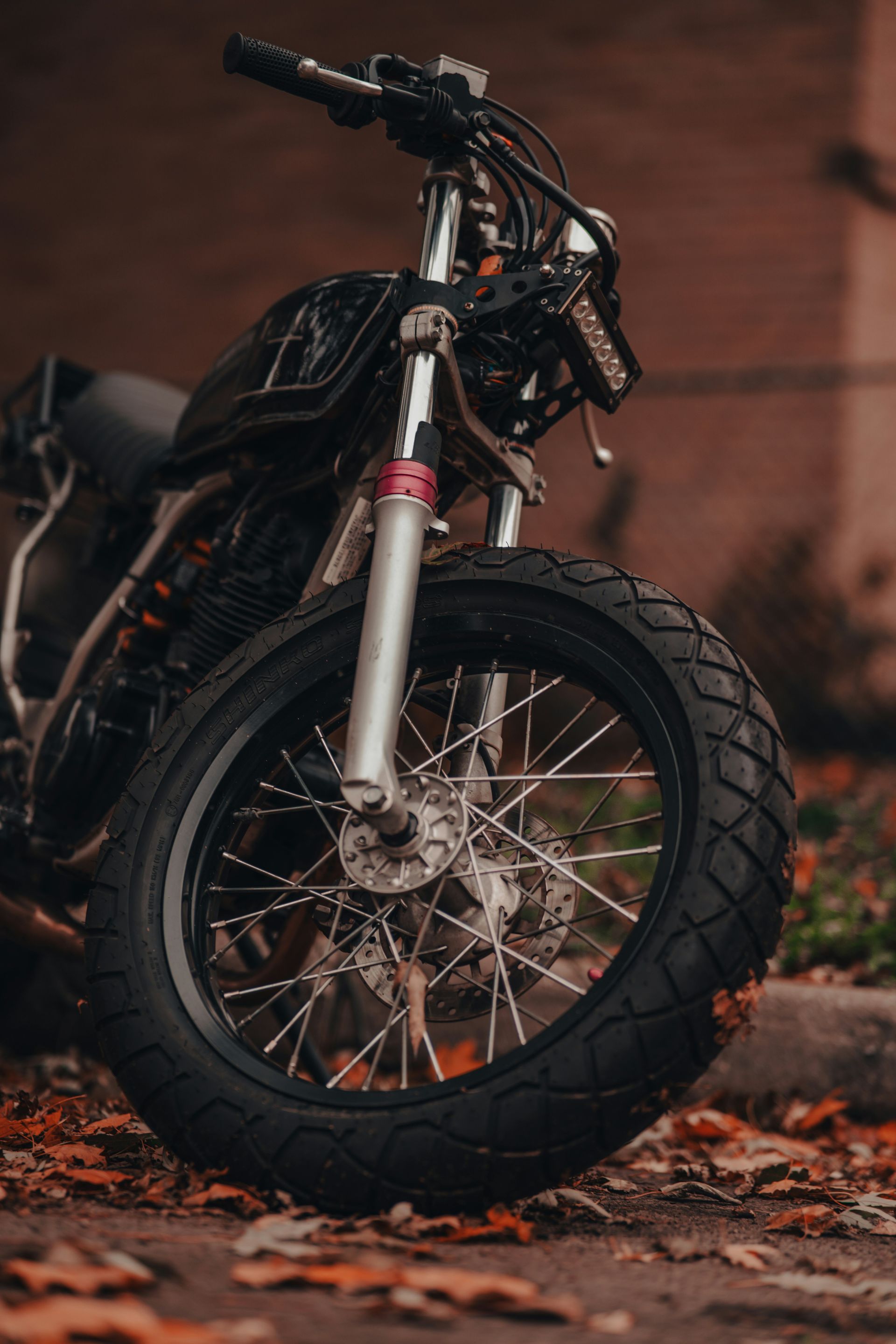 Black Motorcycle, Front Wheel Close-up, Outdoors — Ben's Tyres in Narromine, NSW