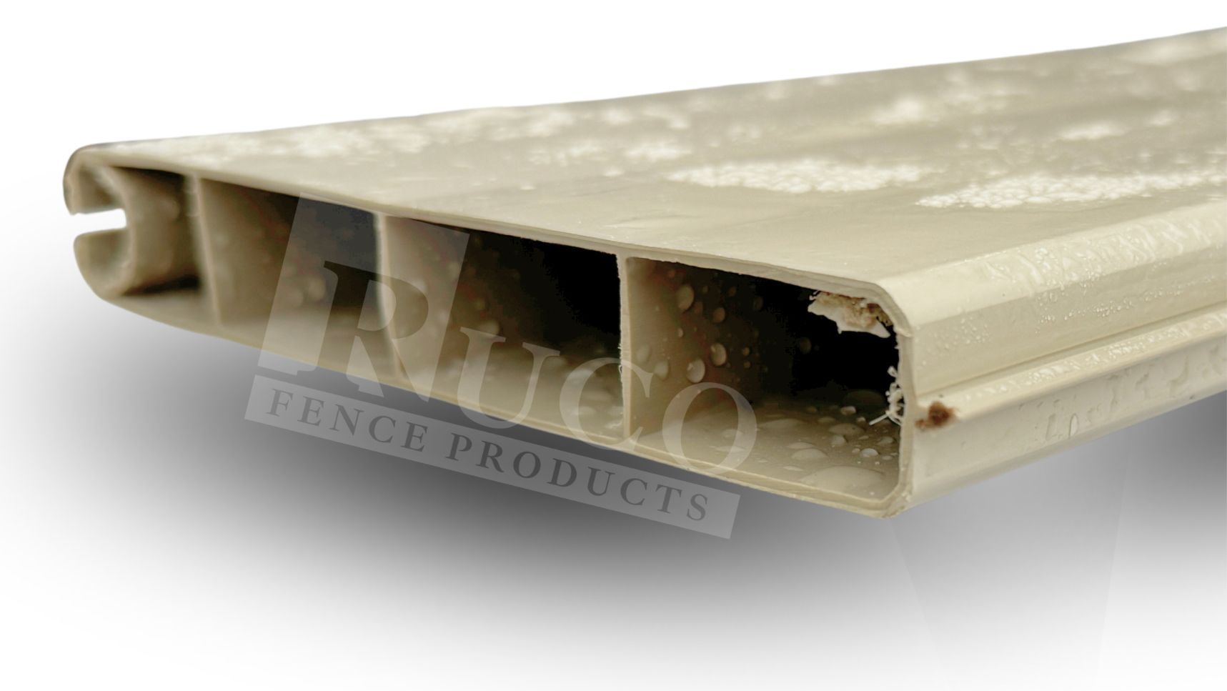 Beige vinyl fence panel cross-section with hollow chambers and smooth surface