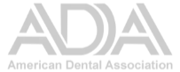 ADA logo, American Dental Association, light grey text on a white background.