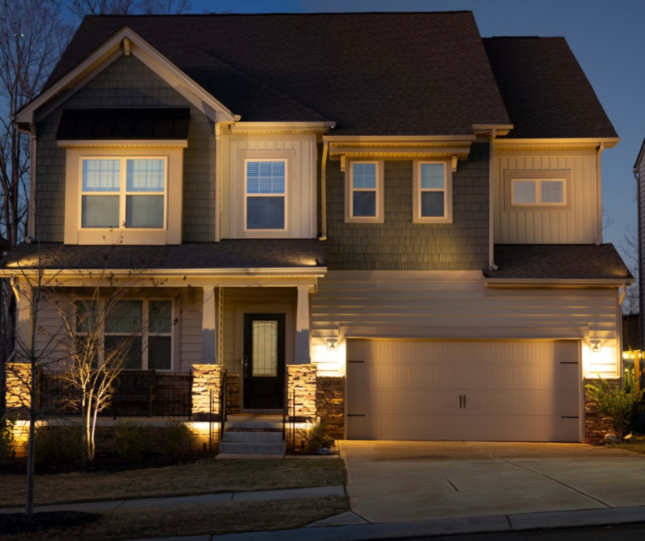 The Front of a House is Lit up at Night – Louisville, KY – Wayne's Lawn Service