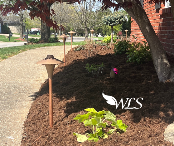 A lawn with a sign that says wls on it