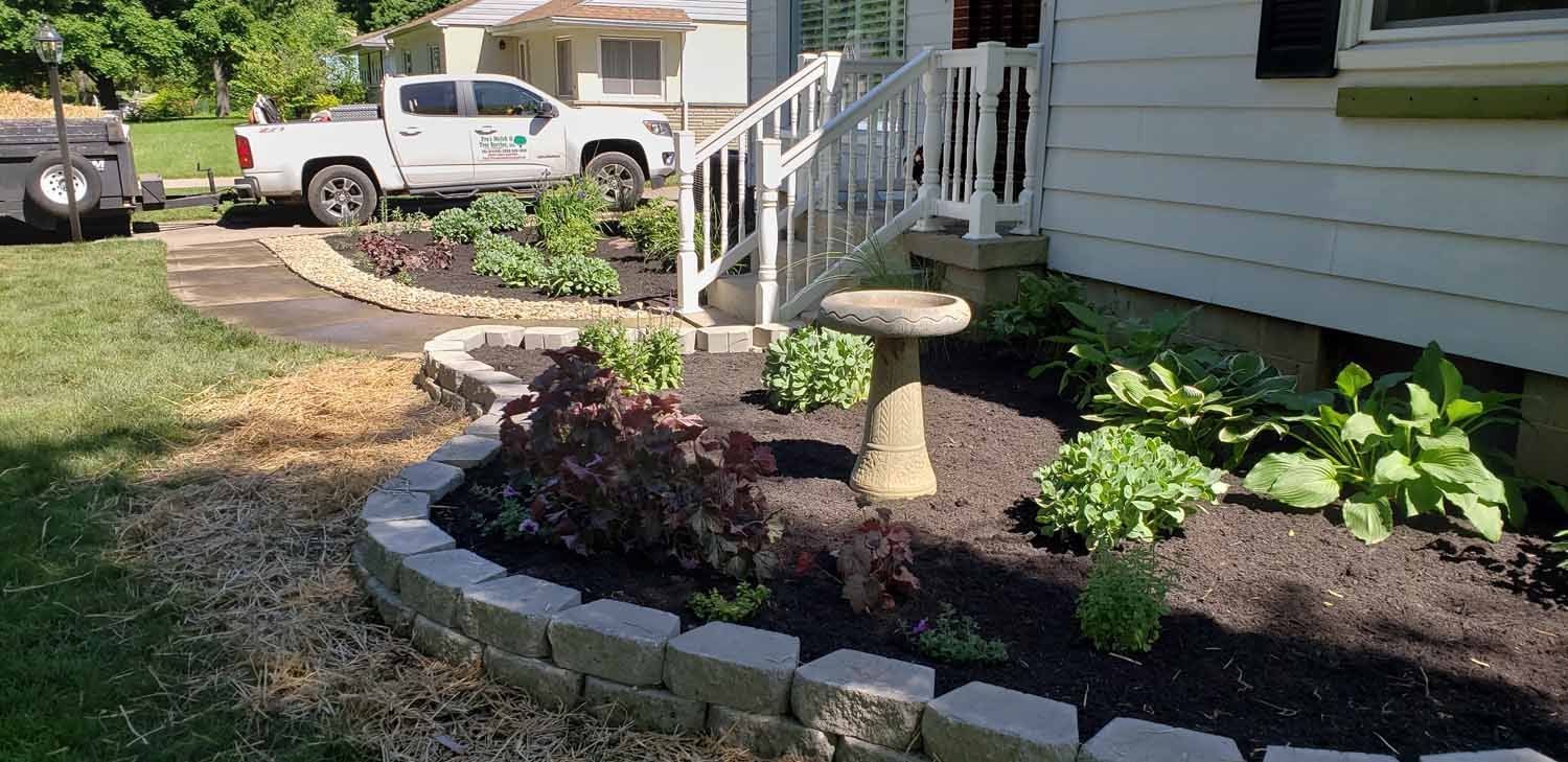 A white truck is parked in front of a house.