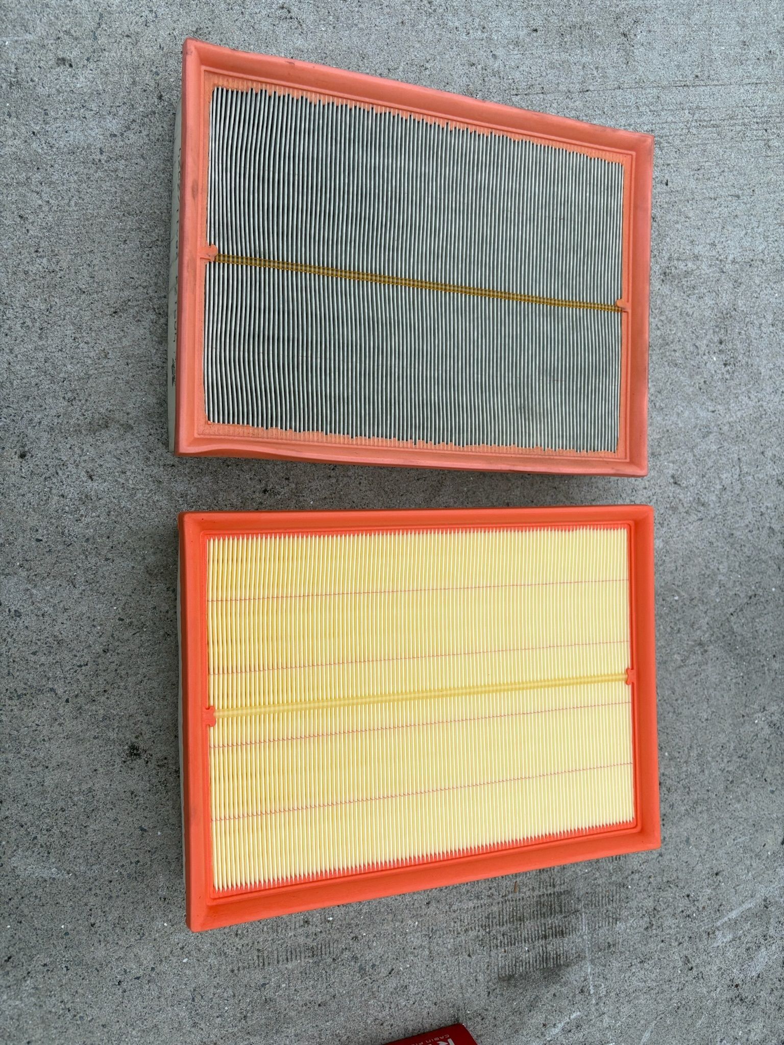 Two Rectangular Air Filters, One Dirty and Gray, the Other Clean and Yellow — Prime Mobile Mechanics in Burleigh Heads, QLD