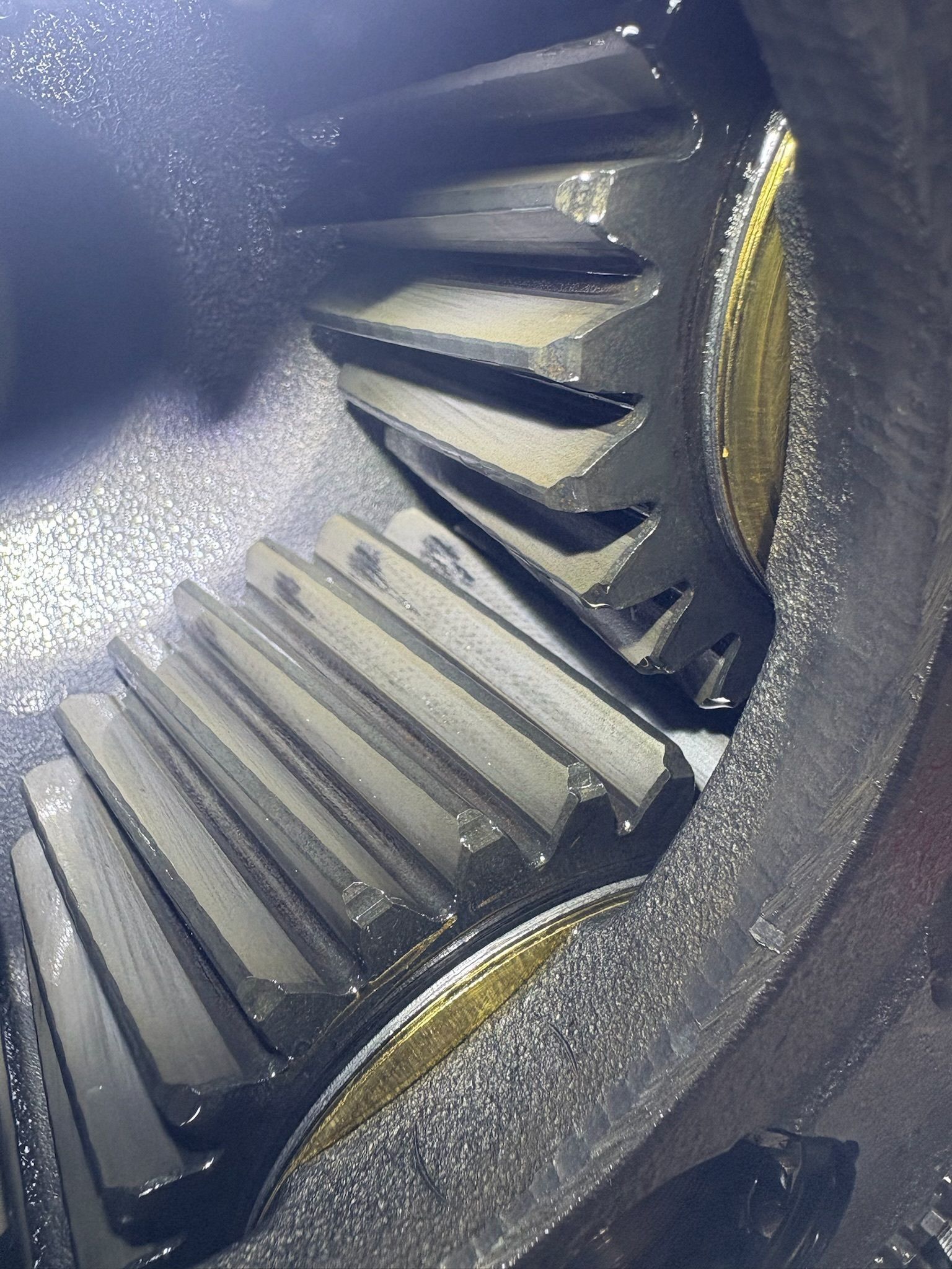 Close-up View of a Gear With Worn Teeth, Coated in Oil — Prime Mobile Mechanics in Merrimac, QLD