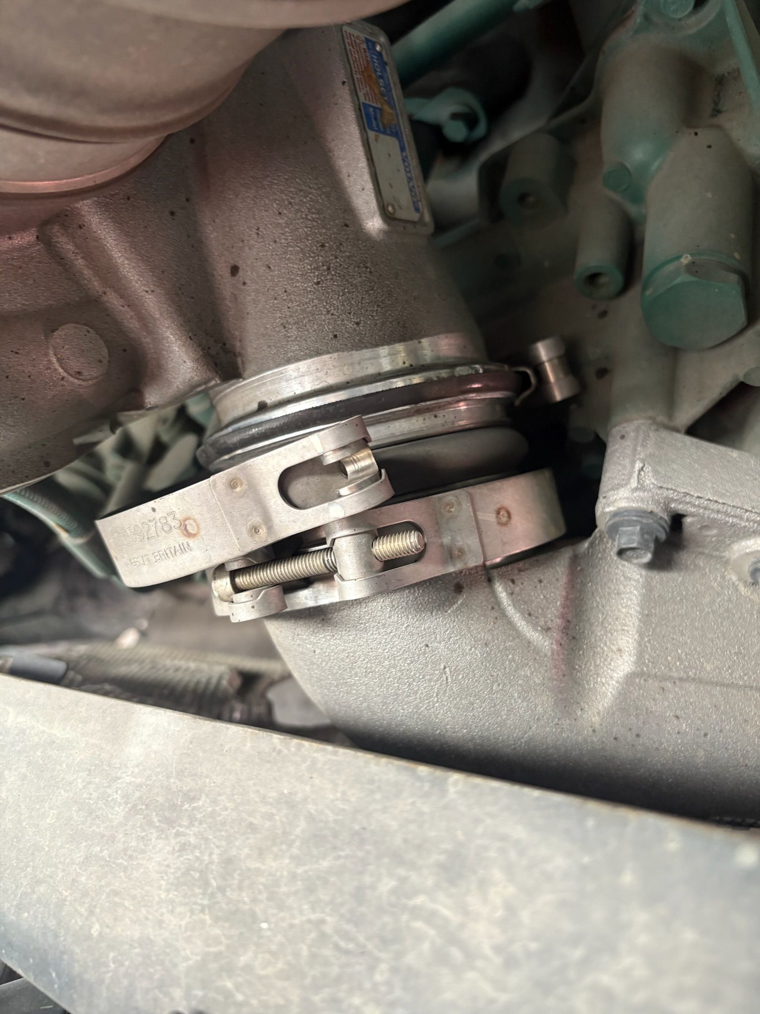 Metal Pipes Joined With a Clamp on a Vehicle Engine — Prime Mobile Mechanics in Nerang, QLD