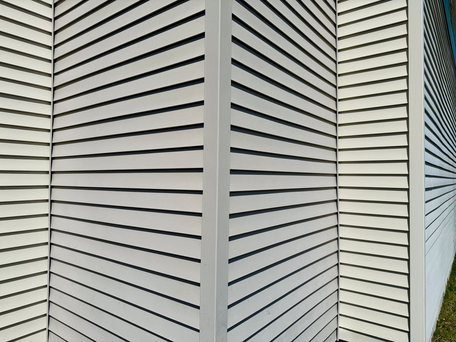White slatted wall corner, angled lines create a perspective.