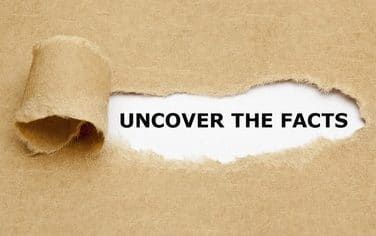 Torn paper reveals uncover the facts text