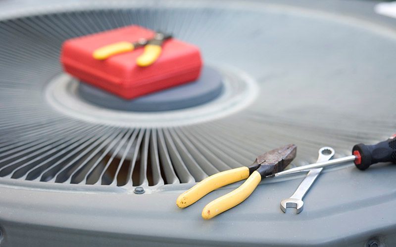 Air conditioner unit with pliers, wrench, and toolbox Air conditioner unit with pliers, wrench, and toolbox
